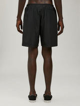 Palm AngelsCurved Logo swimshorts at Fashion Clinic